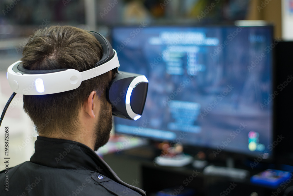 man in VR headset who enjoyng game. Virtual reality. man in VR headset with joysticks man in VR headset who enjoyng game. Virtual reality. man in VR headset with joysticks