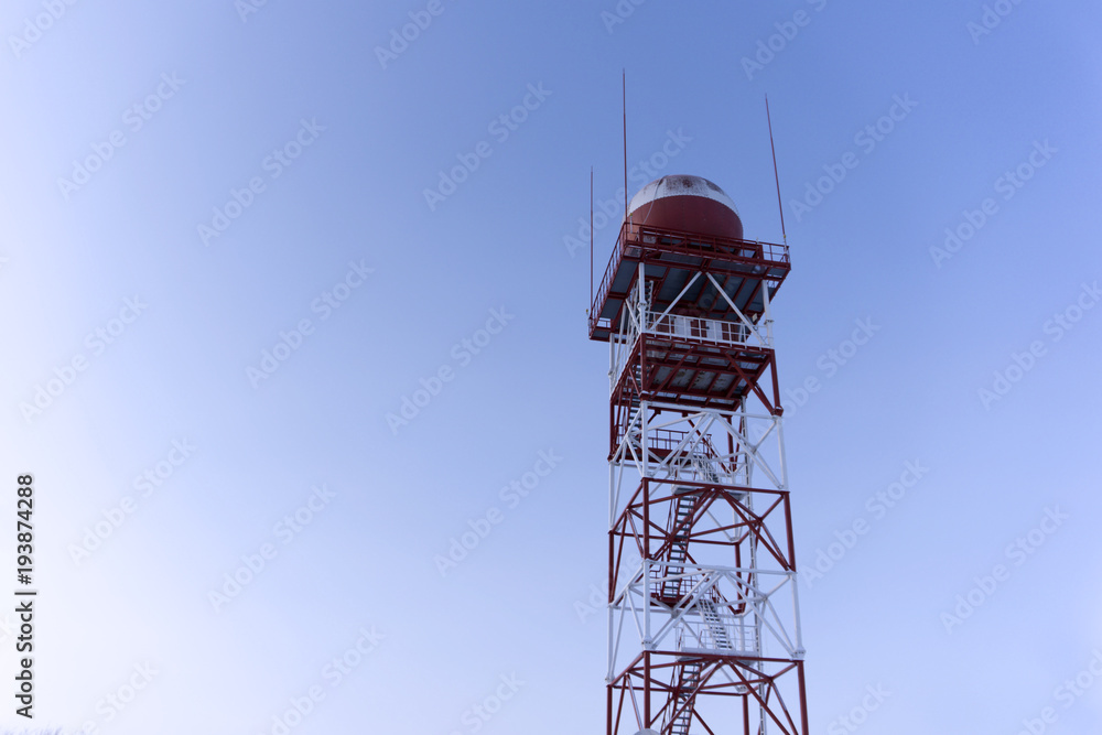 weather surveillance radar in a spherical protective dome, mounted on a trellis tower, against the sky weather surveillance radar in a spherical protective dome, mounted on a trellis tower, against the sky