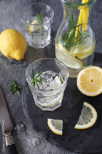 Detox water, fresh lemonade with ice, lemon and rosemary