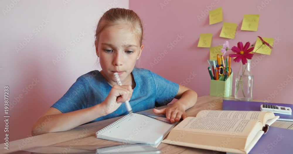 Smiling child studying at home. Dolly shot Smiling child studying at home. Dolly shot