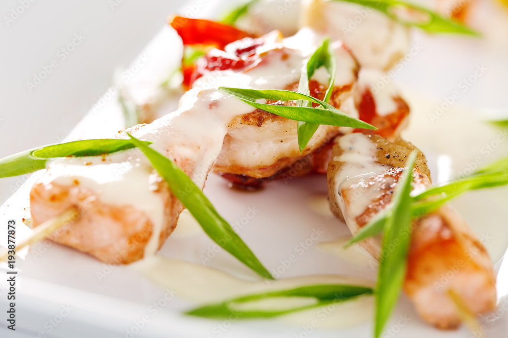 Dishes with seafood skewers with salmon and shrimp. Dishes with seafood skewers with salmon and shrimp.