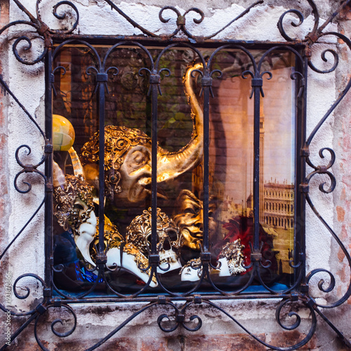 The venetian mask in the window of a souvenir shop in Venice, Italy photo