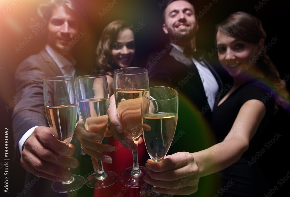 Cheerful people celebrating a sucess with Champagne Cheerful people celebrating a sucess with Champagne