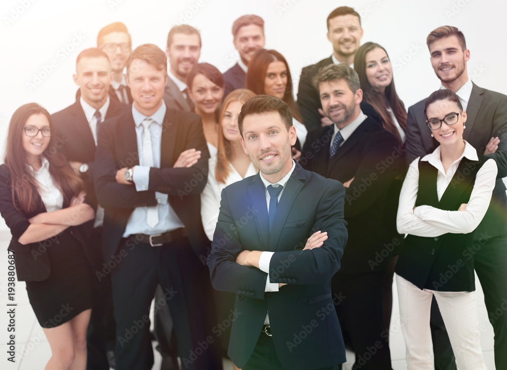 leader standing in front of a large business team leader standing in front of a large business team