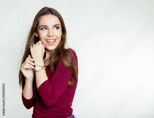 beautiful young woman with long brown hair wearing wrist watch © Anetta