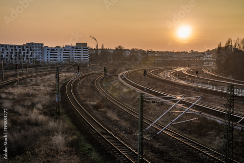 railway tracks and abridge during sunset