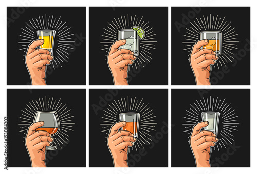 Male hand holding glass brandy, tequila, gin, vodka, rum, whiskey.