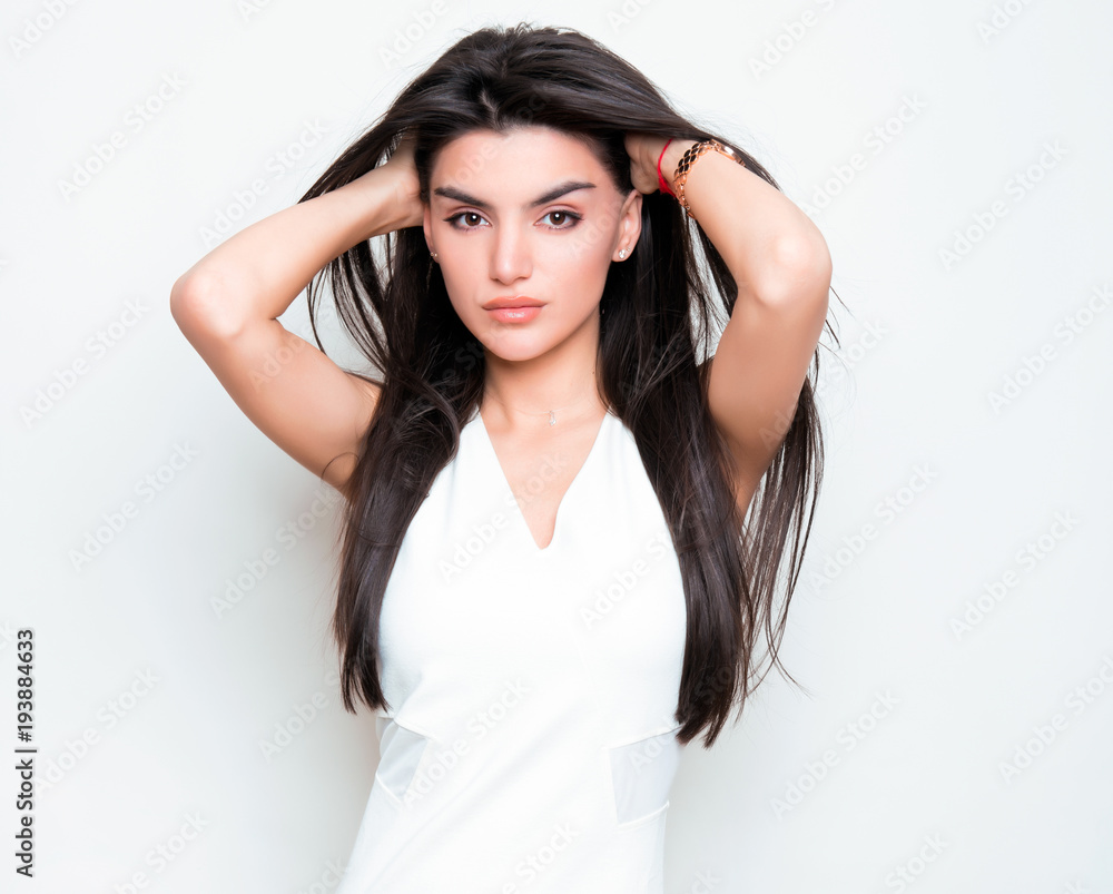 beautiful young woman with long black hair posing in white dress beautiful young woman with long black hair posing in white dress