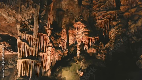Tilt down ancient rock formation drapes on the wall of Saeva Cave, Bulgaria