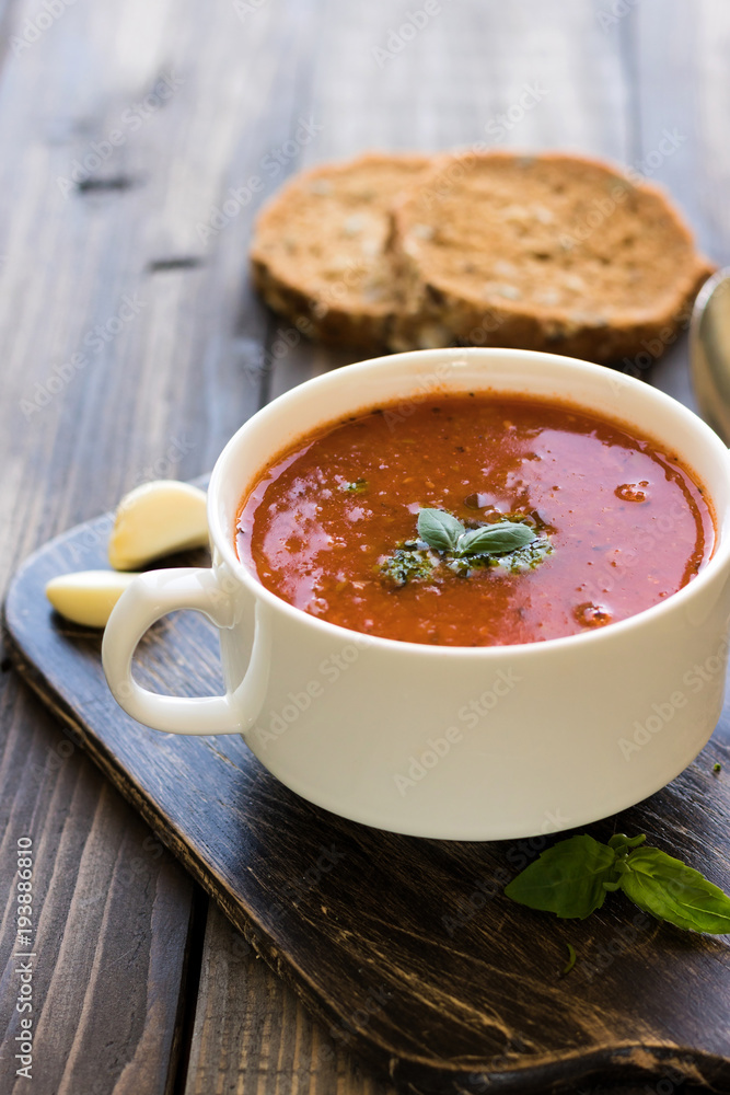 Thick Italian soup minestrone on a wooden table