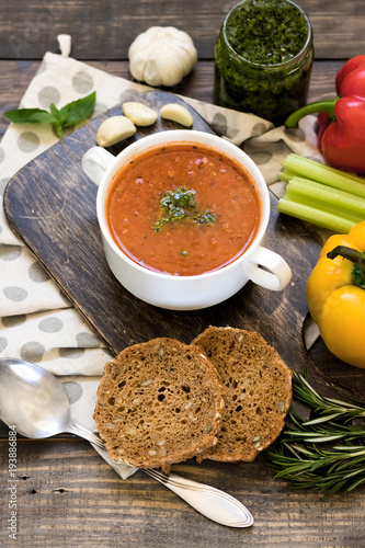 Thick Italian soup minestrone on a wooden table