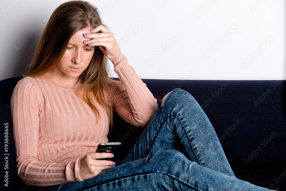 Worried Woman Looking at a Phone Worried Woman Looking at a Phone