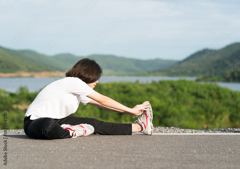 Woman doing exercising and warm up outdoor