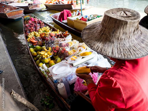 Mango stick ride at Floating market Dam Nern Saduak in Thailand.