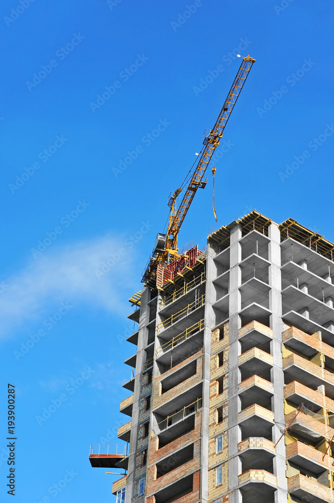 Crane and highrise construction site