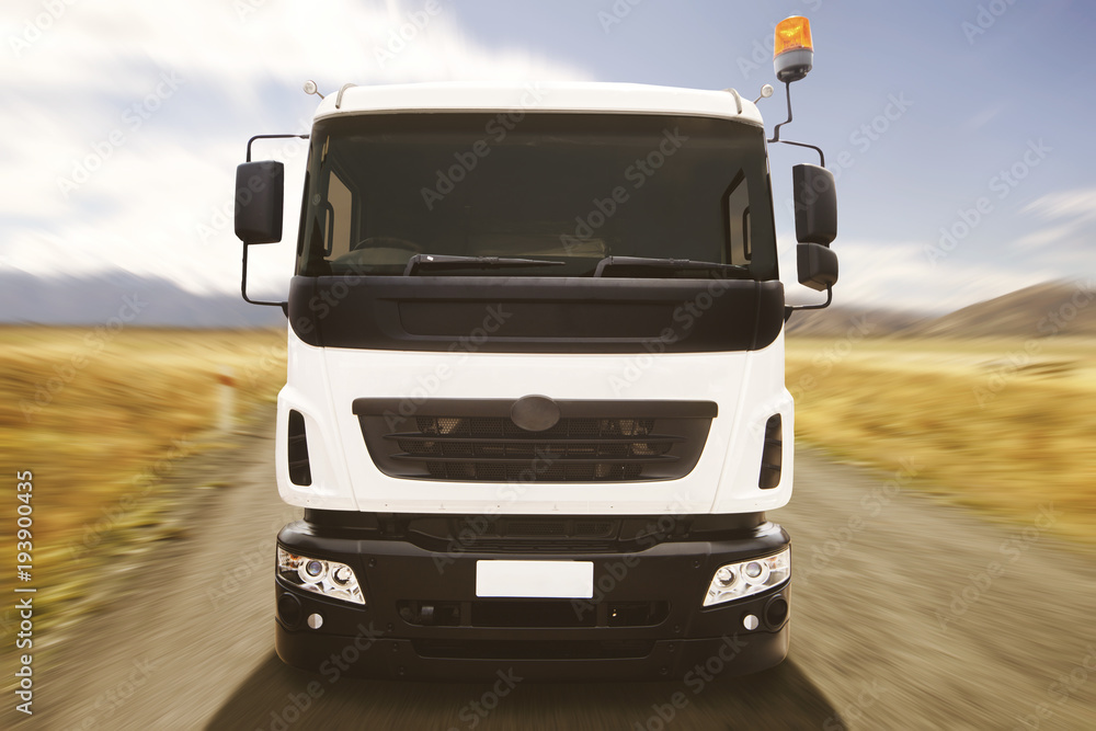 Front view of truck on the gravel road