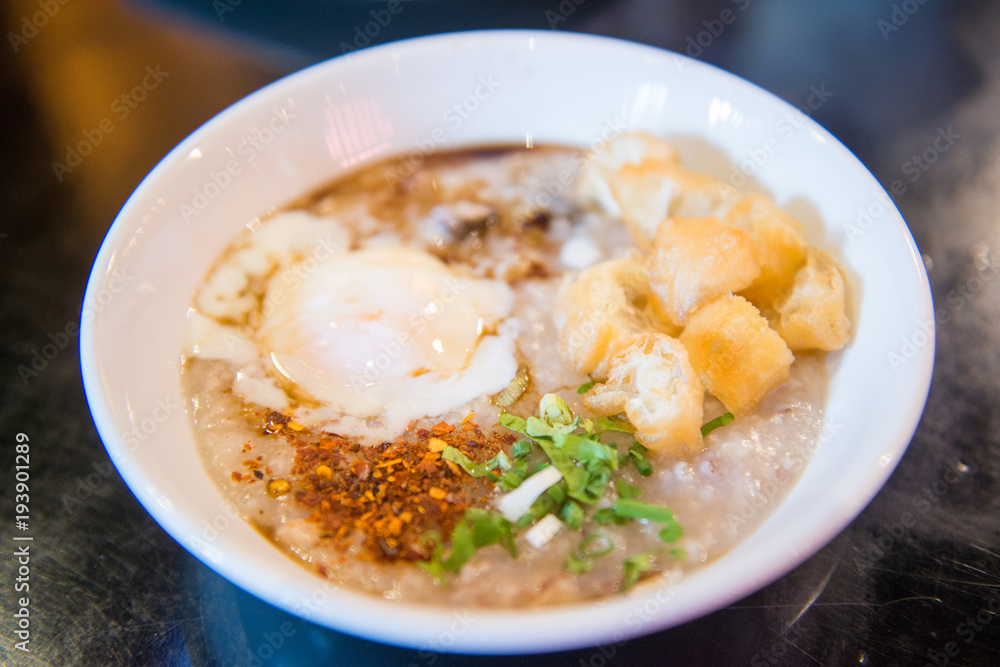 Rice porridge with egg and fried dough stick Rice porridge with egg and fried dough stick
