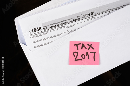 Form 1040 Individual Income Tax return form. United States Tax forms 2016/2017. American blank tax forms. Tax time. photo