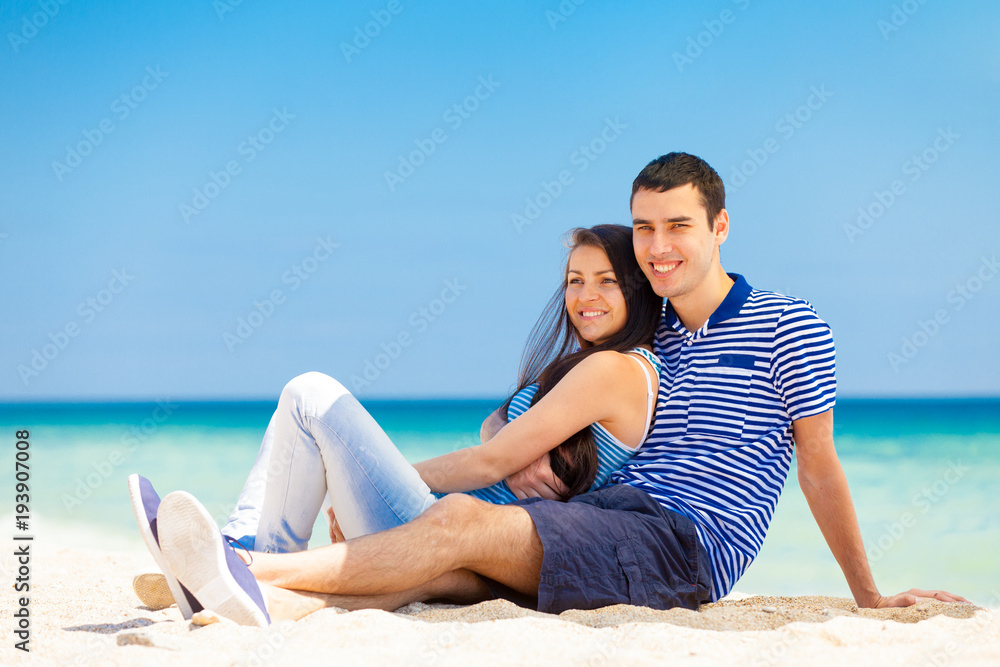 in love couple on the sea beach in summertime.