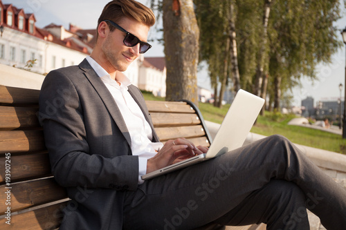 Young business man outdoors work occupation lifestyle. © opolja