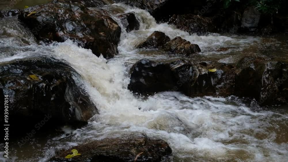 Close up.Pure fresh water waterfall in forest with brown rocks. Close up.Pure fresh water waterfall in forest with brown rocks.