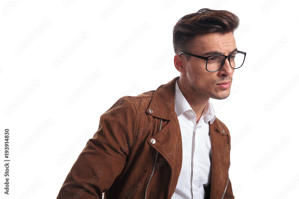 side view of a man in leather jacket and glasses