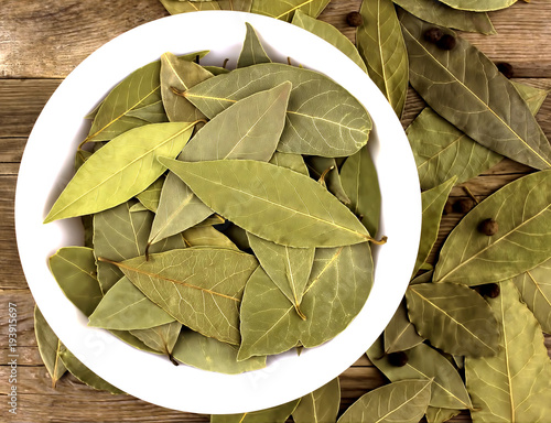 bay leaf dried in bowl on wooden table