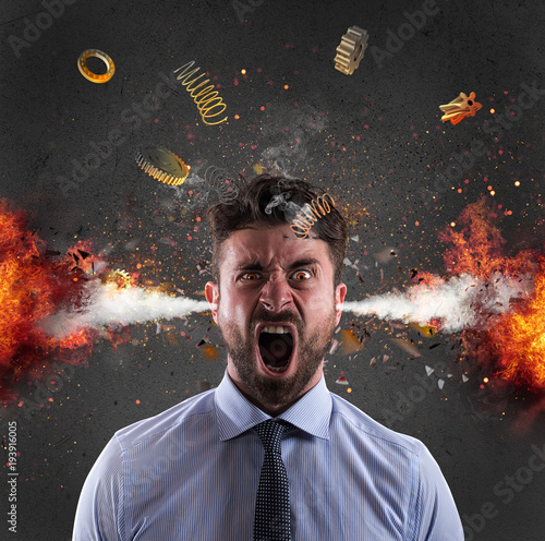 Head explosion of a businessman. concept of stress due to overwork photo