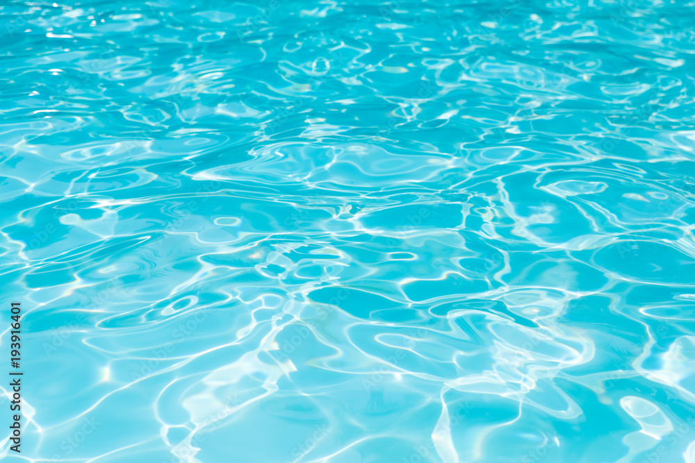 Blue water surface and ripple wave in swimming pool for background, Water level in pool with sunreflection abstract