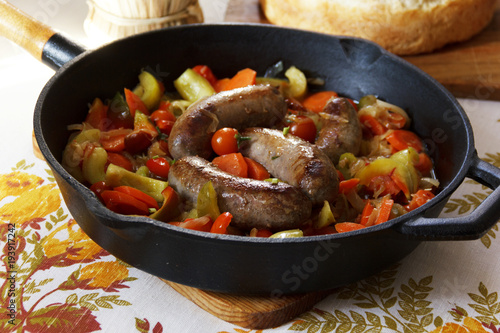 frying pan with homemade sausage and vegetables