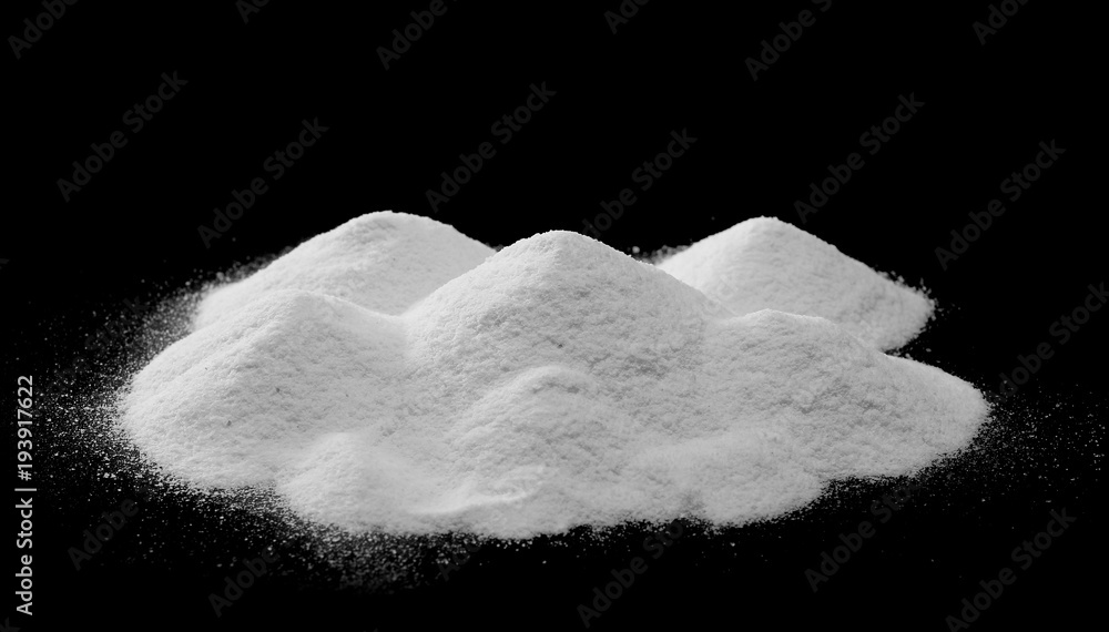 Fototapeta Pile of coconut flour, powder isolated on black background
