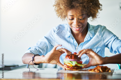 african american woman about to eat meatless vegan burger