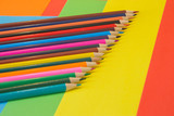 many colored pencils on Colored background. art of color pencils as wallpaper