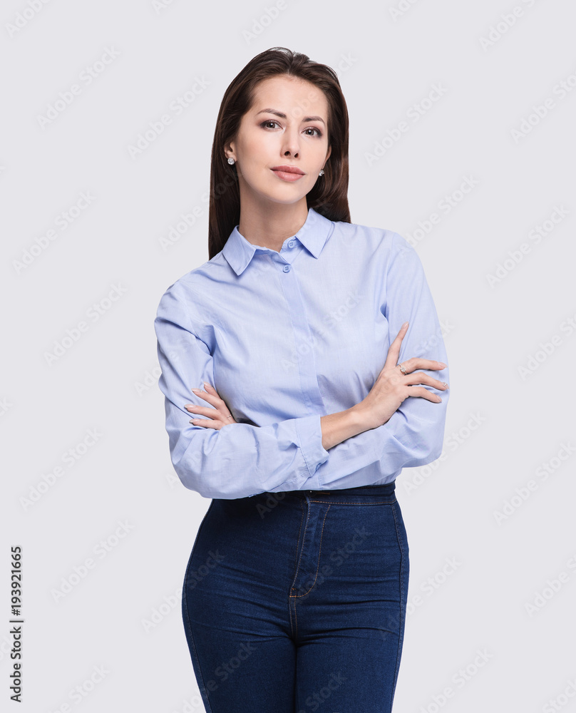 Beautiful young woman portrait. Isolated on grey background. Studio shot. Business person Beautiful young woman portrait. Isolated on grey background. Studio shot. Business person