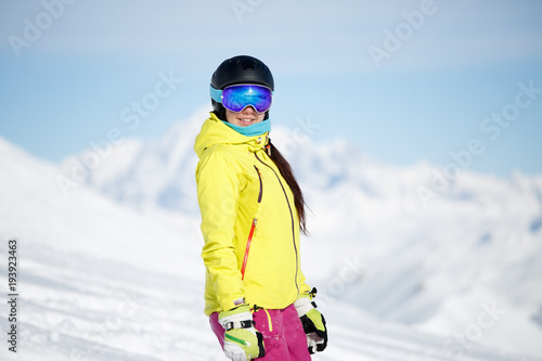 Portrait of sports girl in helmet on mountainside
