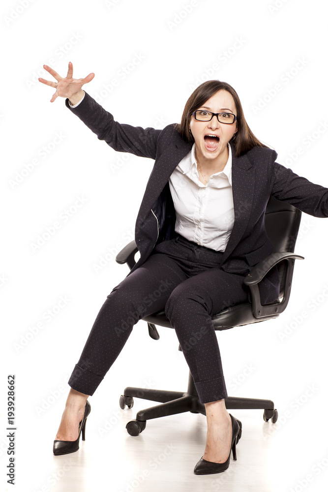 angry businesswoman in armchair shouting on white background angry businesswoman in armchair shouting on white background