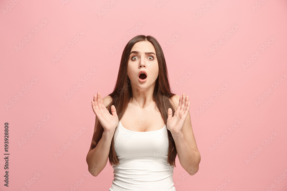 Beautiful woman looking suprised isolated on pink Beautiful woman looking suprised isolated on pink