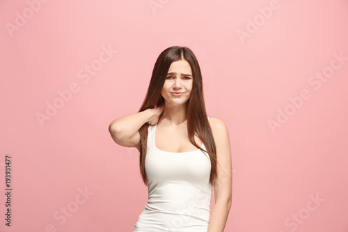 Let me think. Doubtful pensive woman with thoughtful expression making choice against pink background