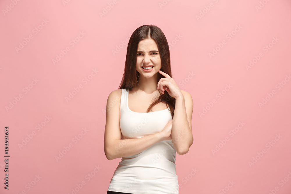 Let me think. Doubtful pensive woman with thoughtful expression making choice against pink background Let me think. Doubtful pensive woman with thoughtful expression making choice against pink background