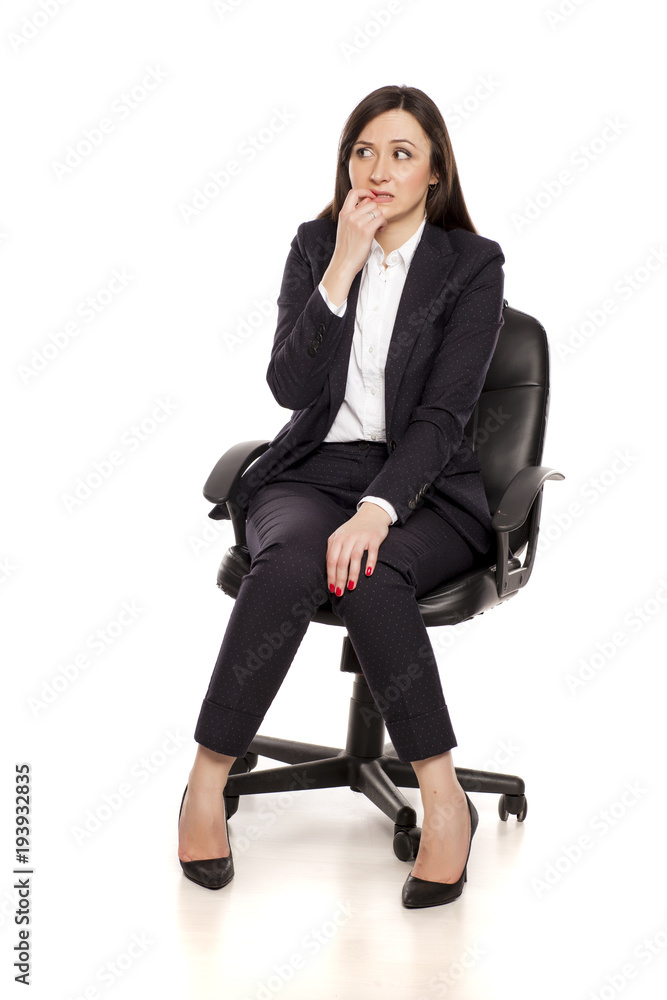 confused businesswoman in armchair on white background confused businesswoman in armchair on white background