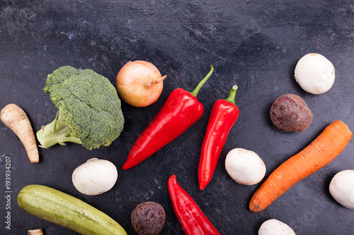 Different vegetables on dark background with copy space available