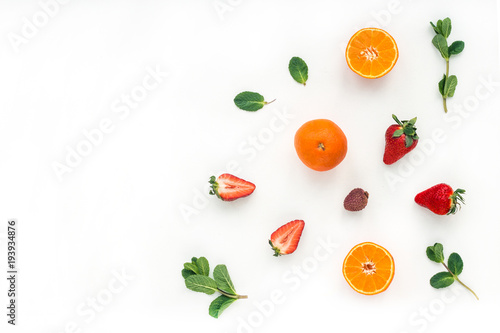 Fototapeta Naklejka Na Ścianę i Meble -  Healthy breakfast with yogurt, muesli, fruits, orange, berry, strawberry, blueberries on white background, flat lay, top view