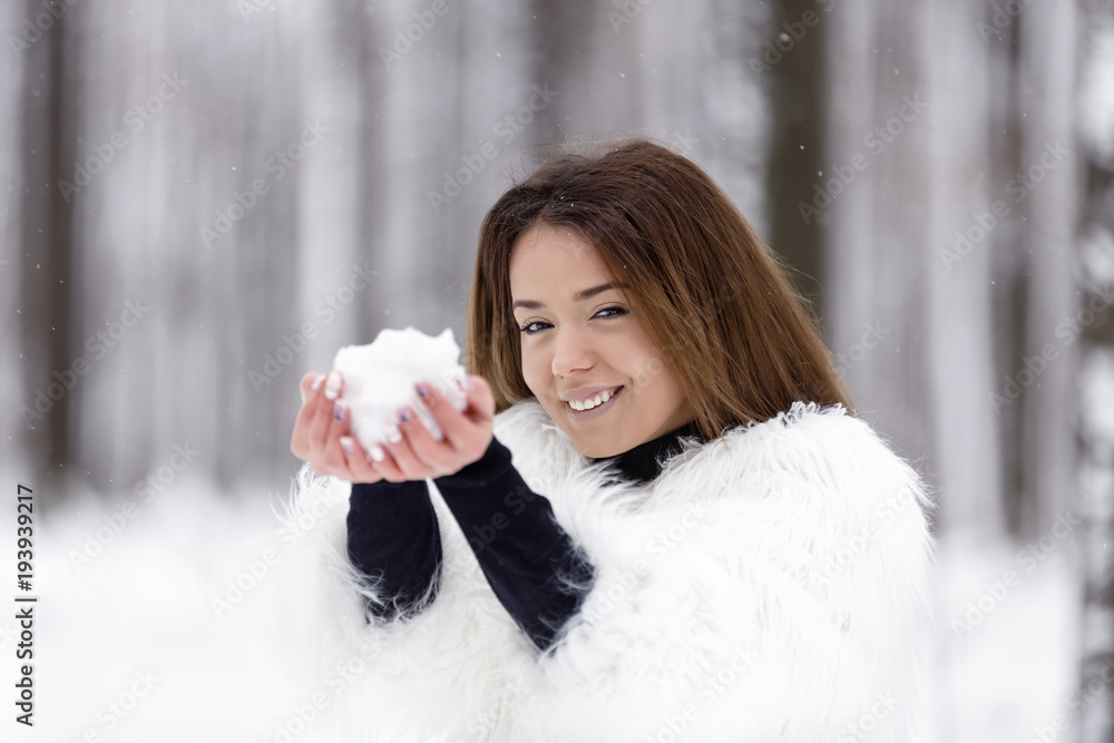 beautiful young woman enjoying winter in the woods beautiful young woman enjoying winter in the woods