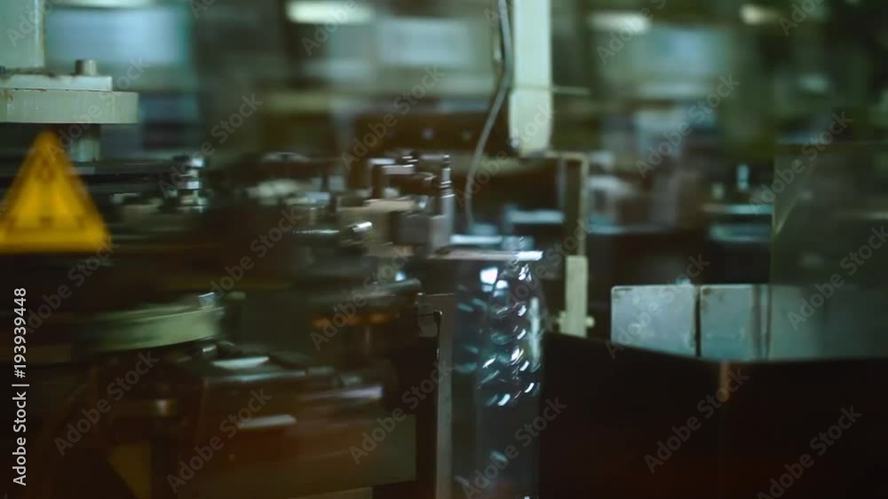 Plastic bottles on conveyor and water bottling machine industry Plastic bottles on conveyor and water bottling machine industry