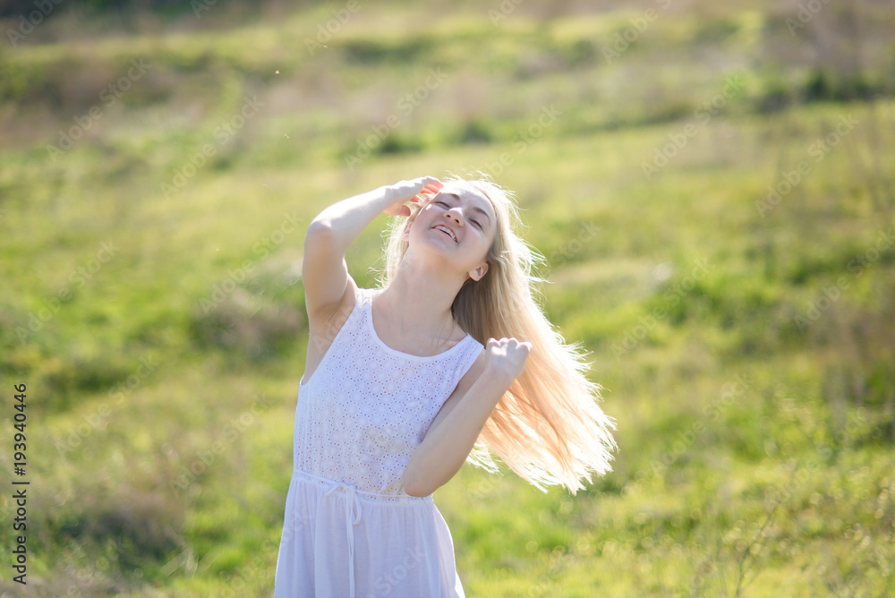 teenager girl is swaying her hair outdoor teenager girl is swaying her hair outdoor