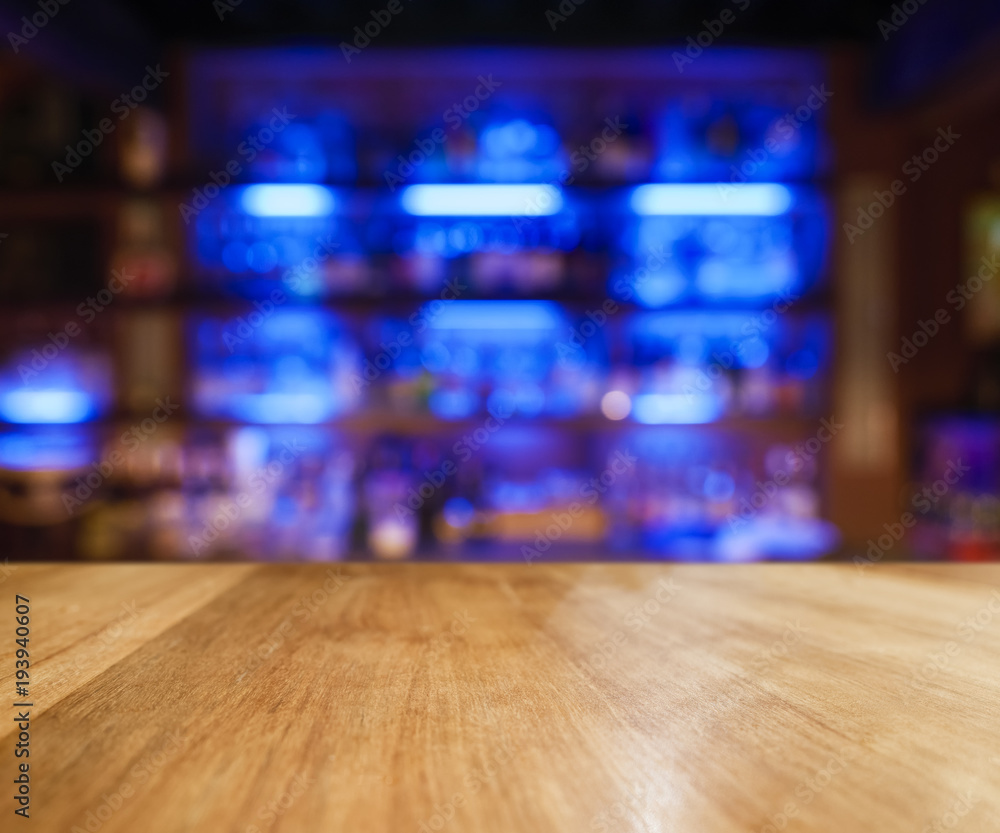 Table top Counter Bar blue light Bottles on shelf Blur bar background