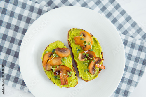 toast avocado and fried mushrooms with bean sprouts