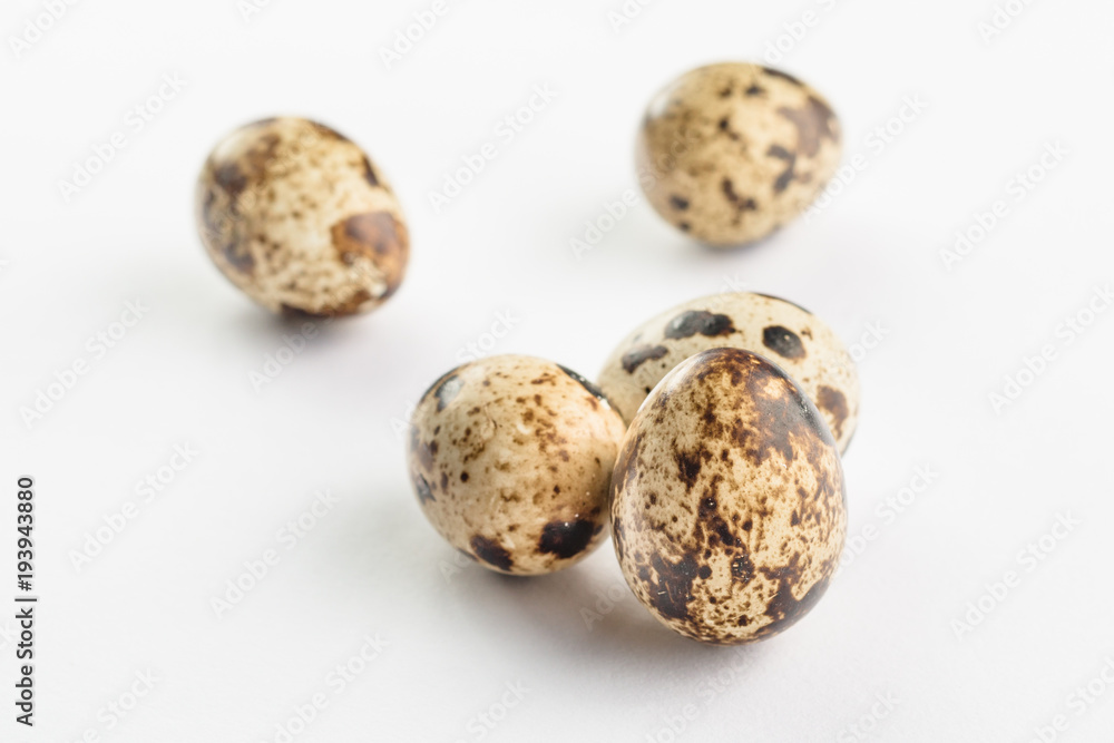 Quail eggs on white background. Organic product. Quail eggs on white background. Organic product.