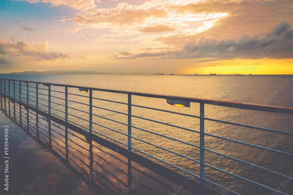 Cruise ship railing at sunset after a rainy day. Cruise ship railing at sunset after a rainy day.