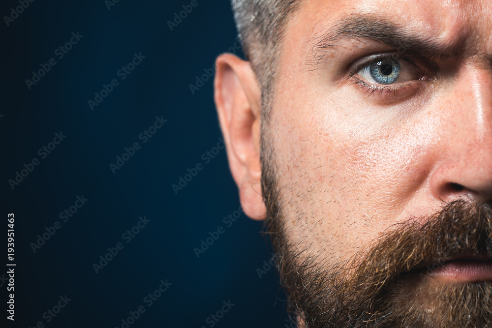 Obraz premium Partial view of a karate man. Portrait of handsome aikido fighter. Strong muscular powerful fighter looks focused and confident. Copy space.
